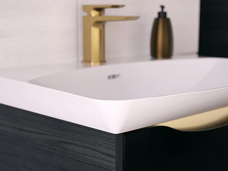 Utopia modern square brushed brass basin mixer above a Lustre Rift basin