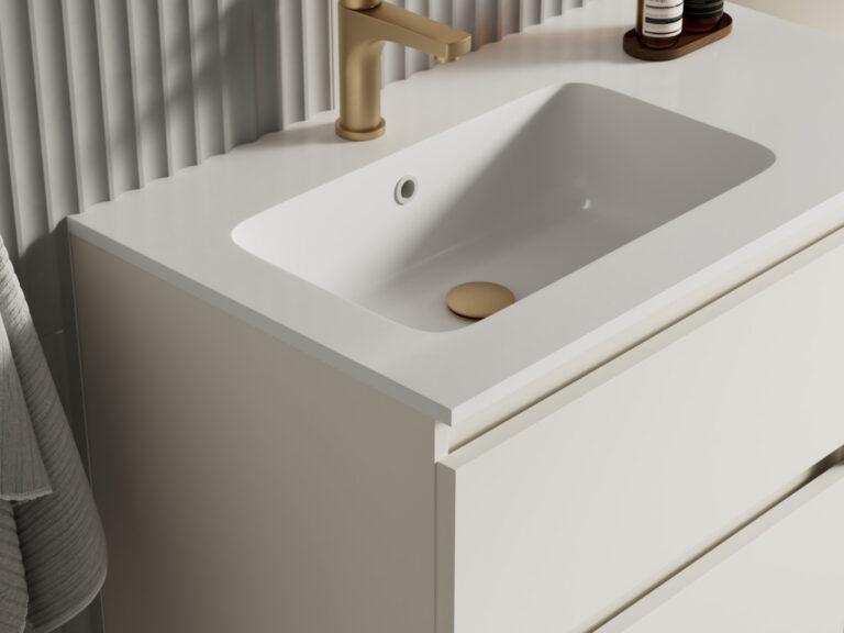 Veldeau white rectangular inset basin and worktop with a brushed brass mixer on a Hartley vanity unit