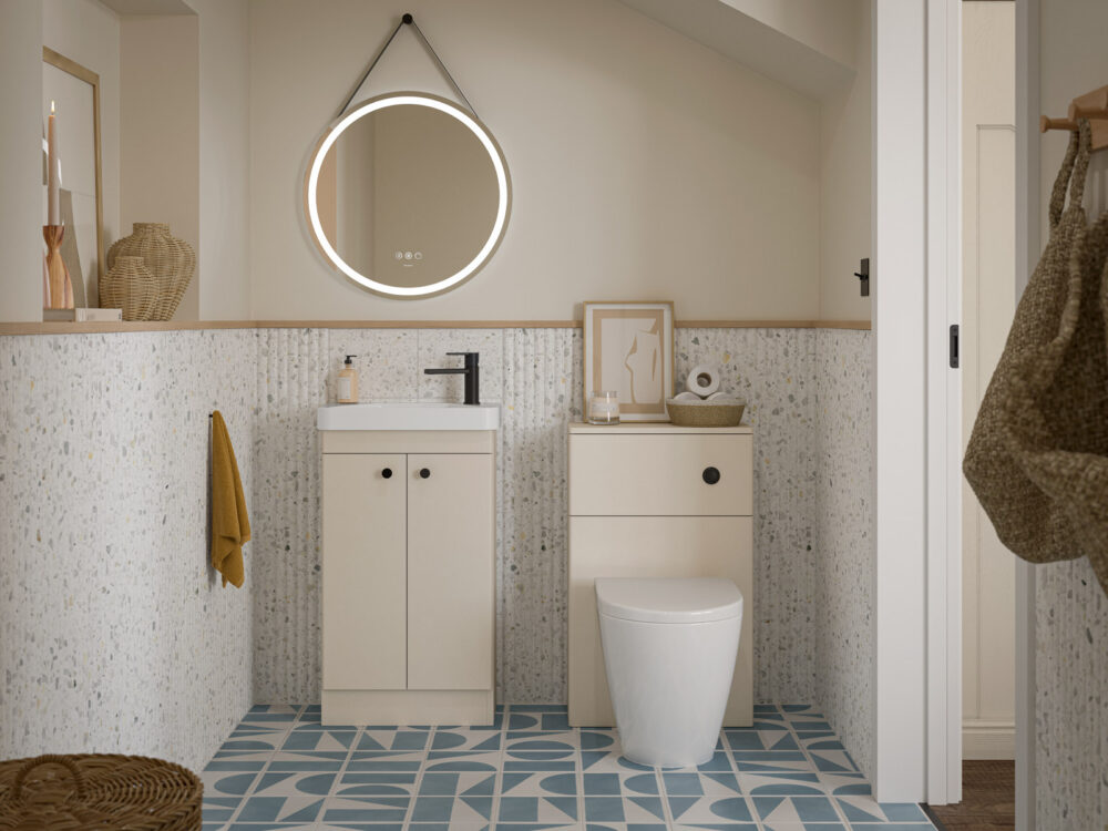 Veldeau Henbury soft sand cloakroom vanity and WC unit with a round illuminated mirror and patterned floor