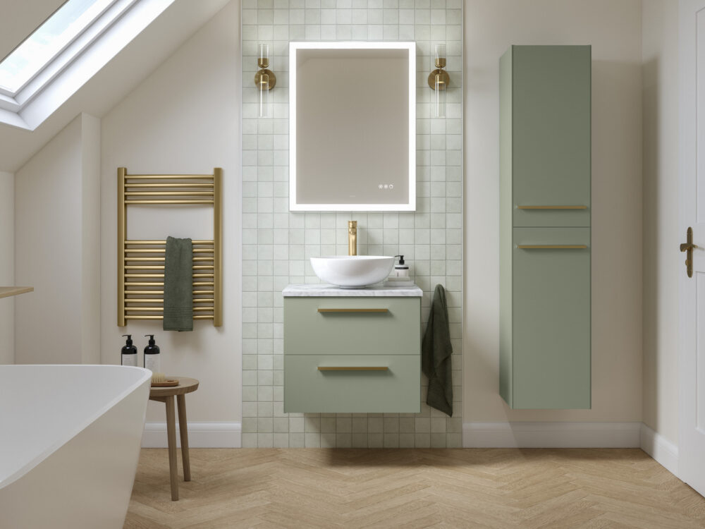 Veldeau Highfield reed green wall-hung vanity and tall unit with a brass towel rail under a sloped ceiling