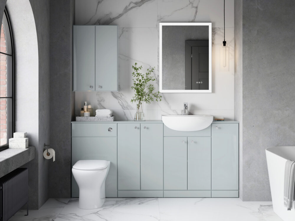 Veldeau Radway urban gloss fitted furniture with a countertop basin and illuminated mirror against marble