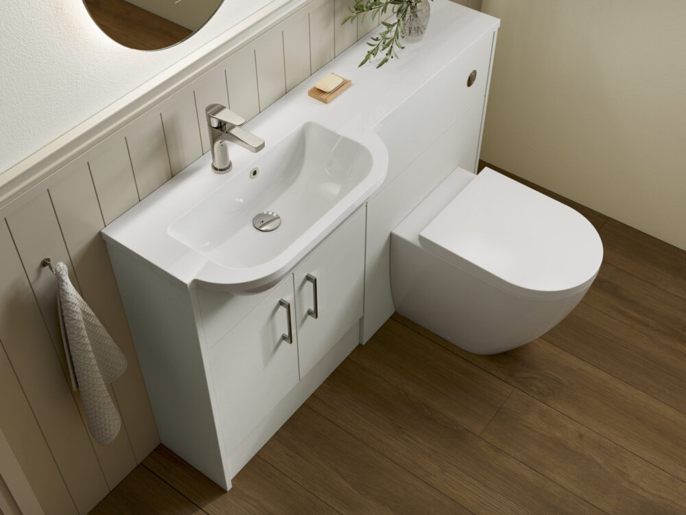 Veldeau Bourton antique white fitted furniture with a curved basin, back-to-wall WC and panelled wall