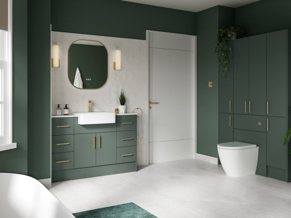 Veldeau Bourton evergreen fitted bathroom furniture with tall storage, an illuminated mirror and brass handles