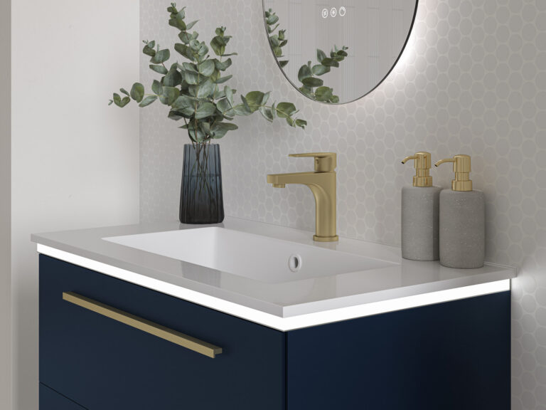 Veldeau brushed brass basin mixer on a white basin above a Highfield nocturne blue vanity unit