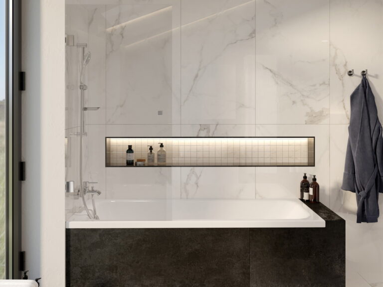 VitrA rectangular bath set into a dark stone surround with a lit niche and marble walls