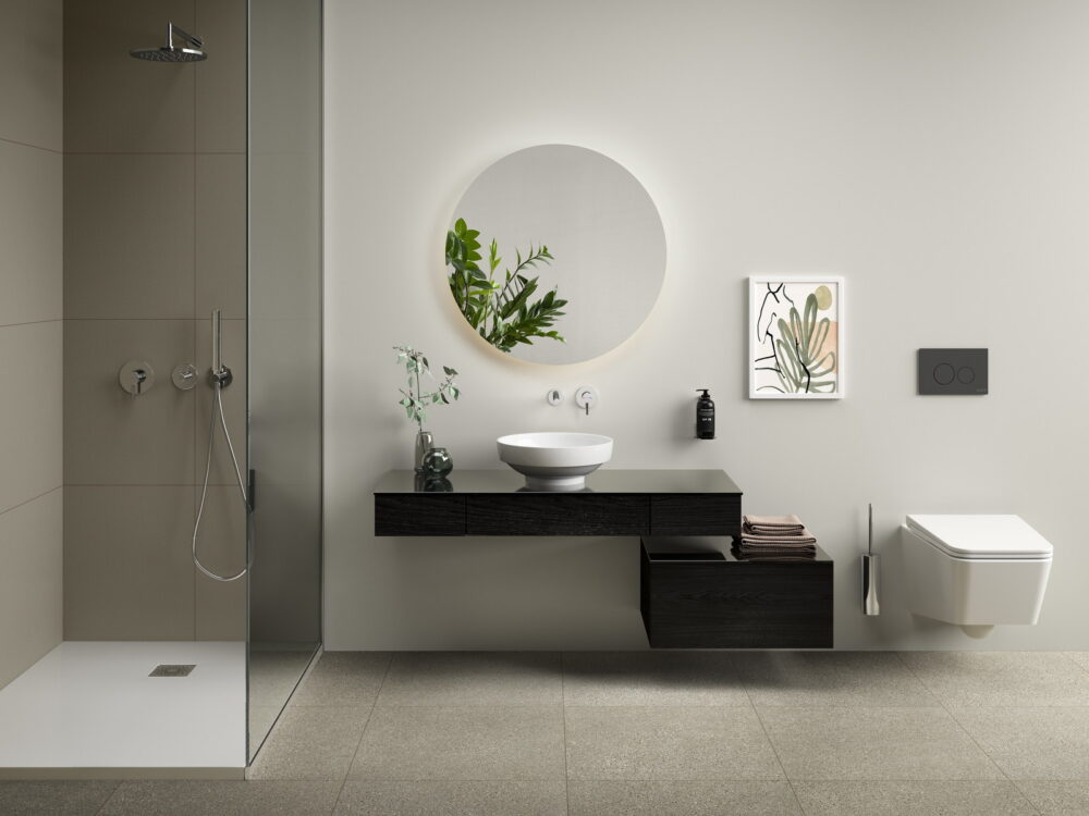 VitrA Origin countertop washbasin on a dark shelf with a round mirror and walk-in shower
