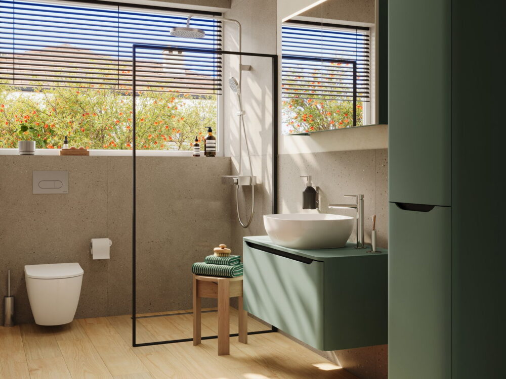 VitrA green wall-hung vanity and mirror beside a walk-in shower with a garden view