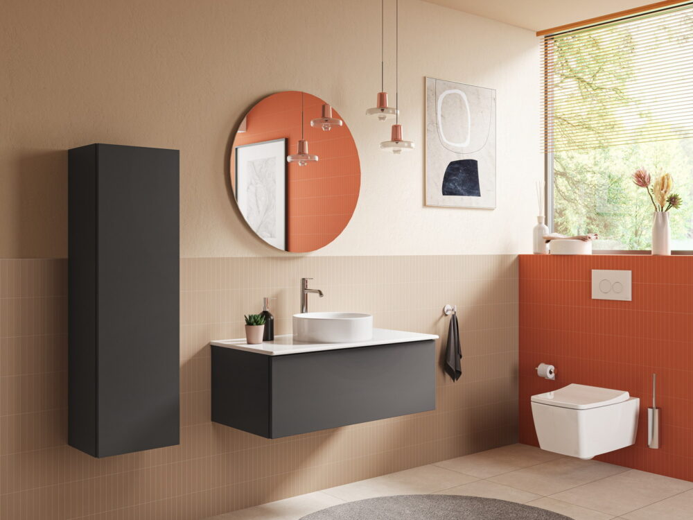 VitrA M-Line wall-hung vanity with a round mirror and pendant lights against a terracotta wall