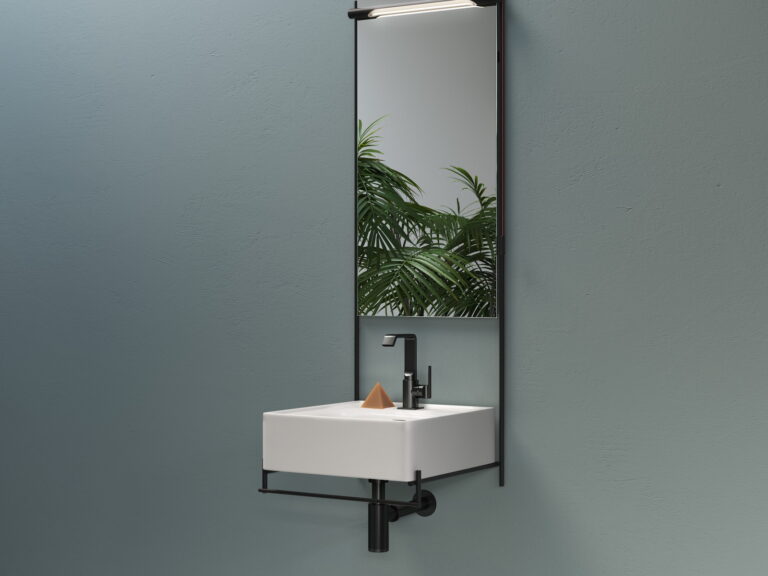 VitrA black-framed rectangular mirror above a wall-hung washbasin on a teal wall