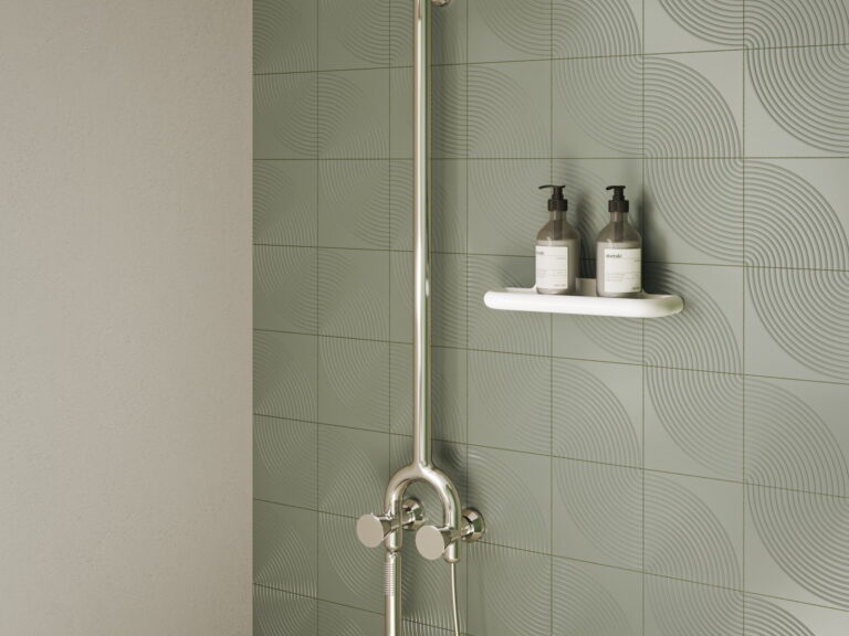 VitrA exposed shower column with a fixed head and handset against patterned sage tiles