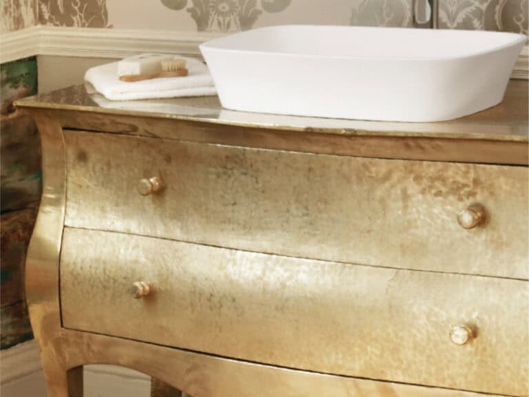 Waters Haze countertop basin on a gilded antique chest of drawers
